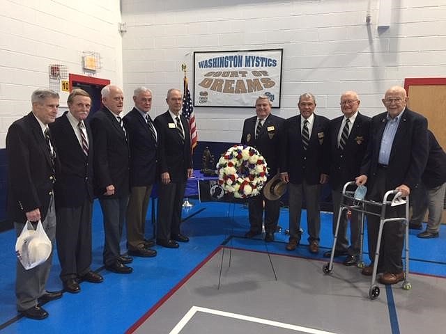 Members of the U.S. Military Academy at West Point class of 1959 gather following the presentation of a wreath in memory of classmate Rocky Versace during the Veterans Day ceremony at Mount Vernon Recreation Center. From left, Lt. Col. Tom Boyle, Col. Dick Toye, Lt. Col. Martin Lidy, Col. Al Phillips, Col. Powell Hutton, Col. John McNerney, Col. Art Bair, Lt. Col. Jack Bohman and Col. Dave Cotts.