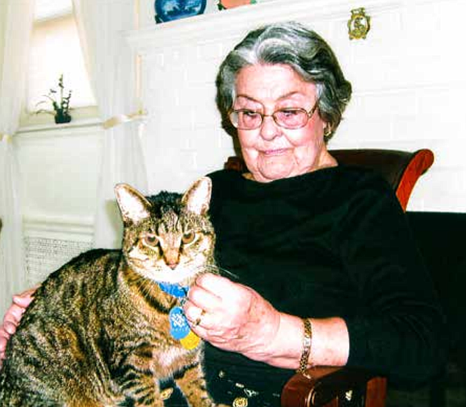 Longtime Arlington resident Gladys Shulaw and Brownie, adopted from AWLA. Shulaw, who was 101 when she died, bequeathed money to AWLA for the establishment of a fund to support the adoption, care, and keeping of cats.