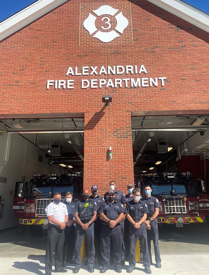 Alexandria Fire Chief Corey Smedley, left, stands with firefighters at the new Station 203 on Cameron Mills Road. The station opened earlier this year, replacing the original station built in 1947.