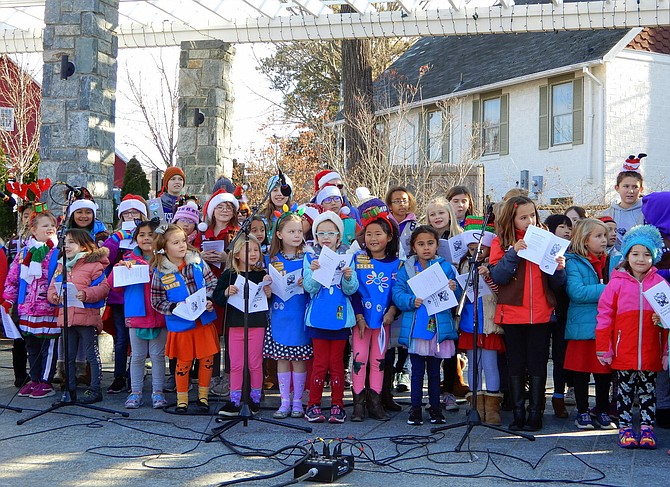 Fairfax City Girl Scouts sing Christmas carols and Chanukah songs during a past Festival of Lights and Carols.