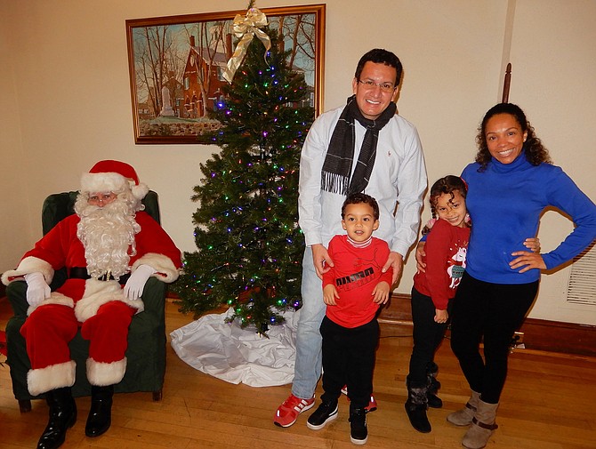 Posing with Santa Claus are parents Manuel and Maritza Moreno with son Mateo, 3, and daughter Mia, 6.