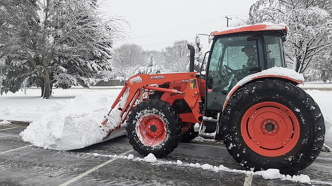 At Hayfield Secondary, the plow was operating while flakes continued to come down.