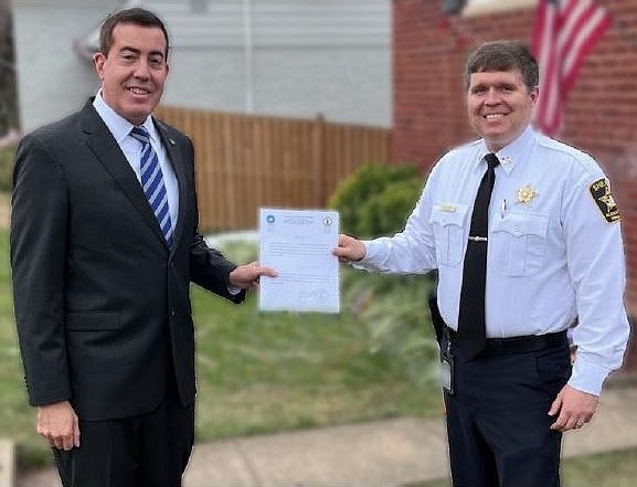 Alexandria Circuit Court Clerk Greg Parks, left, administered the oath of office to Sherriff Sean Casey Dec. 29 at Casey’s home in Alexandria.