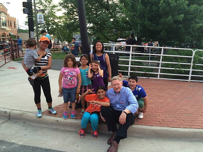 Dranesville District Supervisor John Foust (D) visits the Town of Herndon pre-Covid and talks with future constituents.