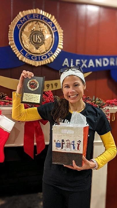 Amber Berry celebrates winning the American Legion Auxiliary Unit 24 chili cook-off Dec. 11 at Post 24 in Old Town. Berry took top honors with her white chicken chili recipe.