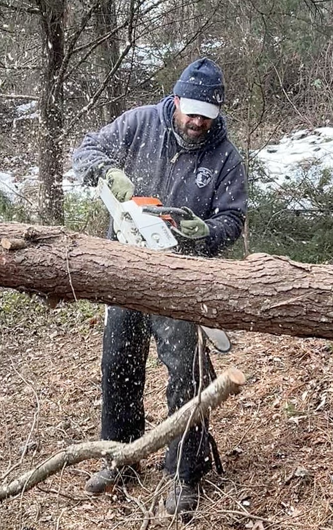 After heavy snow flakes, wood flakes were soon flying as park maintenance crews tackled clearing area trails and home owners cleared yards