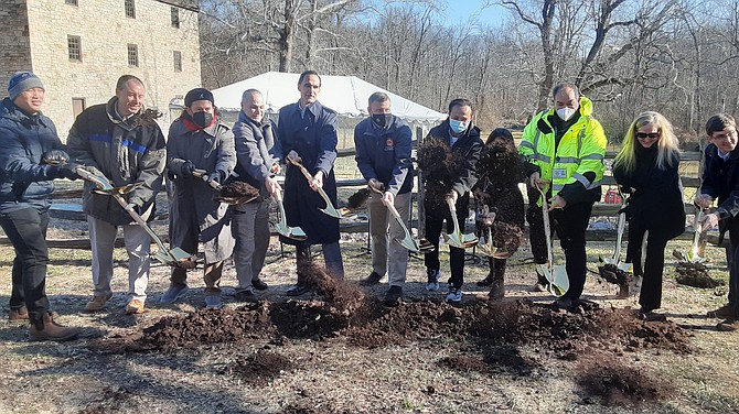 With golden shovels in hand, officials break ground on the Mount Vernon Memorial Highway Trail project.
