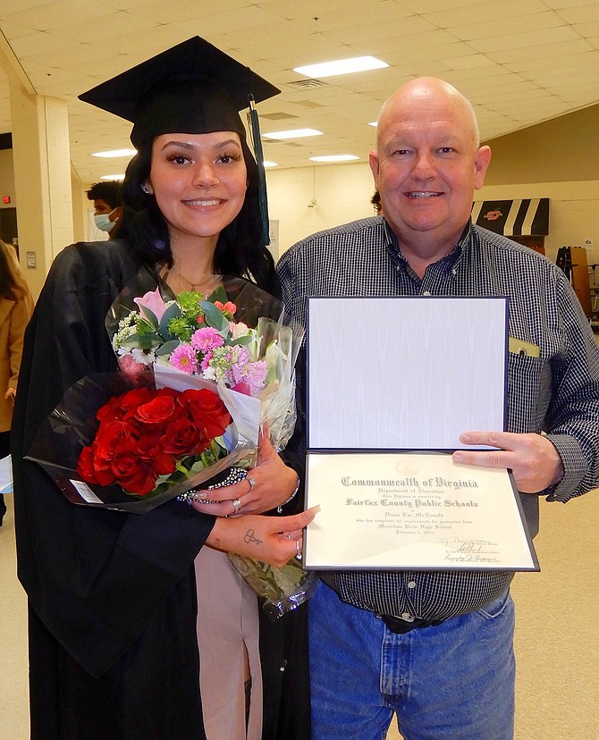 Grad Diana McDonald celebrates with her dad, Mac McDonald.
