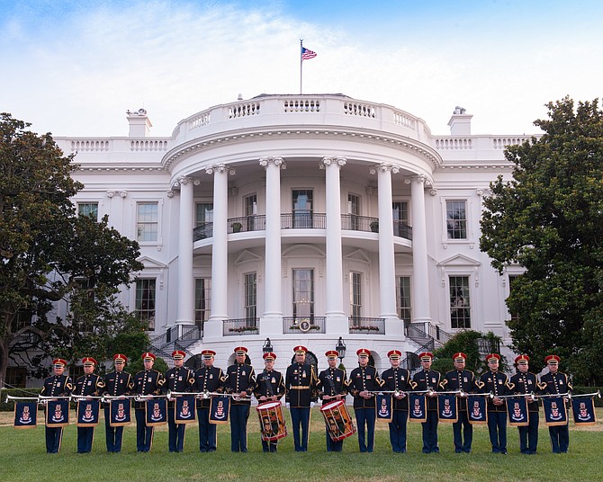The U.S. Army Herald Trumpets pose for a photo on the White House lawn. The Herald Trumpets are The Official Fanfare Ensemble to The President of The United States.