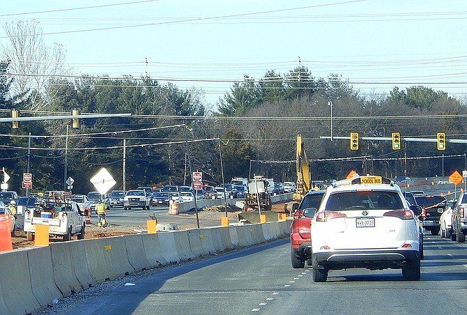 Construction proceeds on Route 28 in Centreville, while traffic packs both sides of the road, during afternoon rush, heading north toward the Old Mill Road intersection.