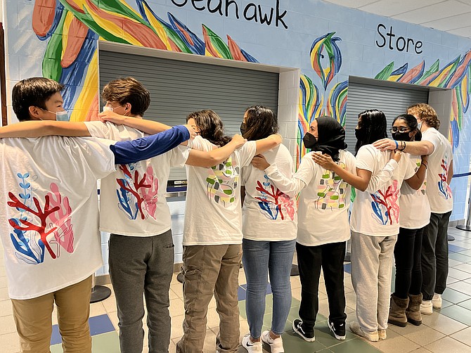 IRIS company members model their t-shirts,  available for purchase by SLHS sophomore Sofia Pakhomkina. https://iris-collective.square.site/ Artwork, screen-printed on a t-shirt, focuses on the environmental problem of global warming and coral reef bleaching. Net proceeds from this product are going to the Coral Reef Alliance.