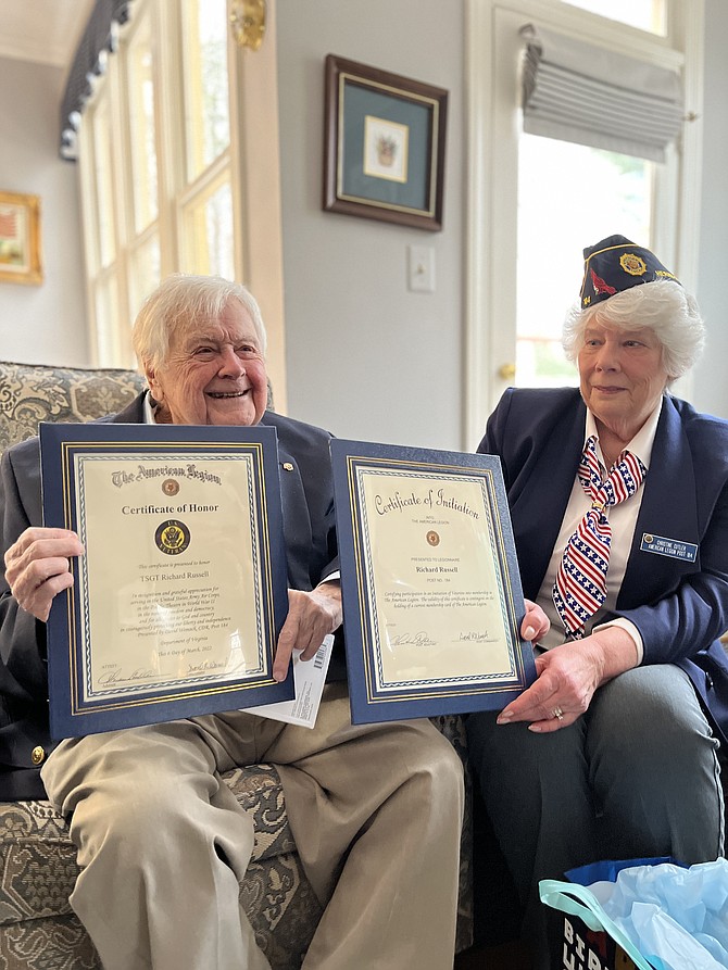 From left, Richard T. "Dick" Russell Jr., of Great Falls receives The American Legion Certificate of Honor from Christine Cutler, Post Adjutant of The Wayne M. Kidwell Legion Post 184 Herndon-Reston on the occasion of his 100th birthday.