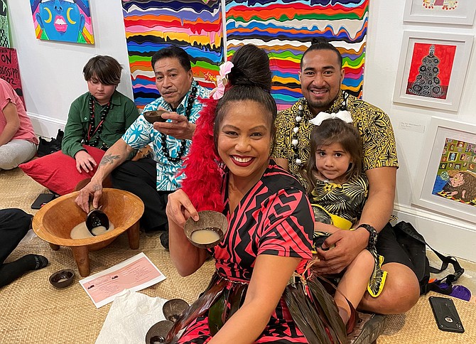 Alfasene Alipia enjoys a traditional drink of Kava at the Tonga Tsunami Relief fundraiser March 5 at Galactic Panther Gallery on King Street.