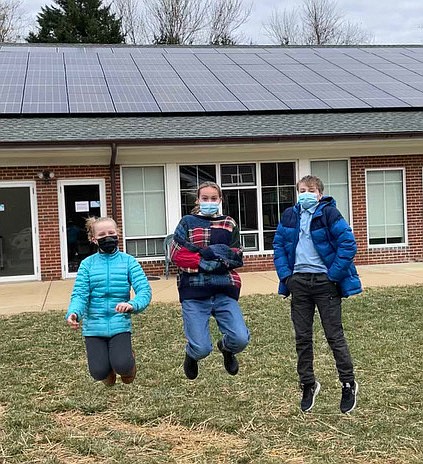 Rock Spring UCC youth Clara Rainhart and Evelyn and Cooper Keefer show their enthusiasm after the installation of solar panels in February at Rock Spring Congregational United Church of Christ. Aerial view of new solar roof.