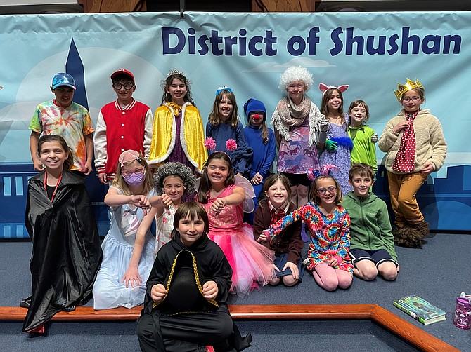 Religious school students of Agudas Achim Congregation of Northern Virginia pose for a photo March 16 following the performance of “Muppet Megillah.”