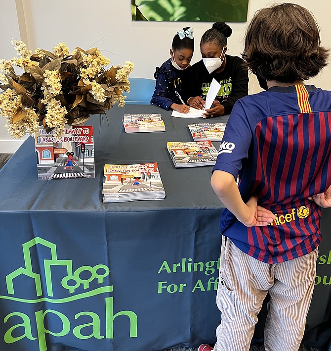 On March 24 Nadia Conyers and her daughter Arrington read their new children’s book to residents who live at APAH’s Gilliam Place.