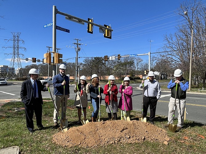 State and town officials at the Friday, March 25 groundbreaking for the Van Buren Complete Street and Herndon Parkway Intersection project. 
<bt>From left, Scott Robinson, director, Public Works, Town of Herndon; Bill Ashton, town manager, Town of Herndon; Virginia Delegate Irene Shin; former Herndon Mayor Lisa Merkel; Herndon Mayor Sheila Olem; Herndon Councilmember Naila Alam; Brian Glover, vice president, A&M Concrete Corporation; and  Richard Smith, senior civil engineer, Town of Herndon