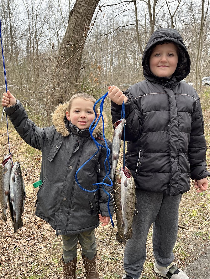One hour after Kids Fishing Day 2022 begins in Reston, the Farley boys, Wesley, 4, and James, 8, have yet to be out-fished.