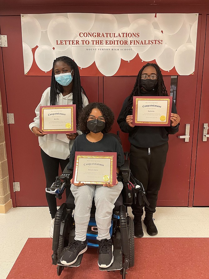 Mount Vernon High School Letter to the Editor contest finalists Afra Ofori, left, and Rachel Adu, right, celebrate with first place winner Makayla Adams March 24 at MVHS.