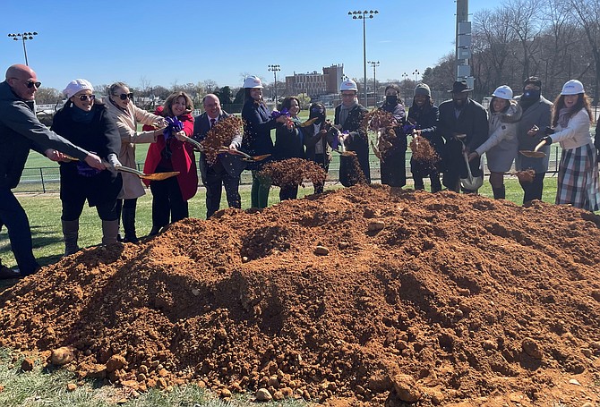 Members of City Council,  School Board and ACPS staff participate in the groundbreaking of the new Minnie Howard Campus of Alexandria City High School March 29 at the school’s soccer field.