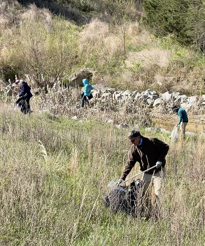 Volunteers check small creeks which collect water run off and trash that will eventually reach the Chesapeake Bay