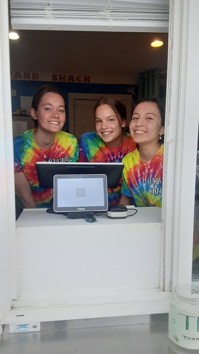 Greer Jones, left, Natalie Coats and Eliana Zelaya are now dishing out custard seven days a week.