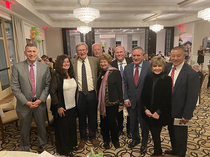 From left, Rick Solano, Jackie Taylor, Supervisor John Foust (D-Dranesville), Bill Canis, Elizabeth Huebner, Scott Knight, Chris Rich, Winnie Frost and Gary Pan attend For the Love of Great Falls, a benefit gala to support the Great Falls Grange Foundation.