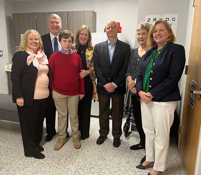 Bishop Ireton Head of School Kathleen McNutt, at right, joins the family of Debbie File at the May 7 dedication of the school’s Health Clinic. Pictured are File’s sister Cindy Golubin, widower Jerry File, grandson Charlie Adamoli, daughter Jocelyn Adamoli, son-in-law Joe Adamoli and sister-in-law Mary-Ellen File.