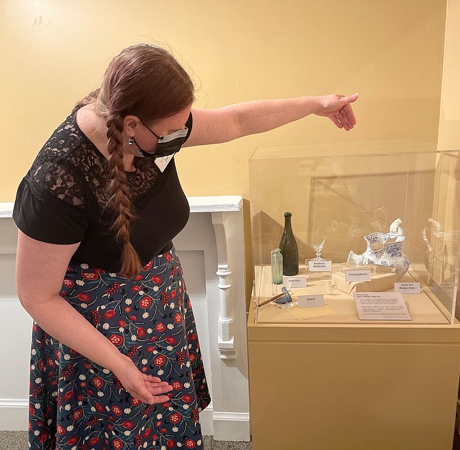 Juli Blacker, a Museum Educator for the Office of Historic Alexandria, describes artifacts on display at the Freedom House Museum June 20.