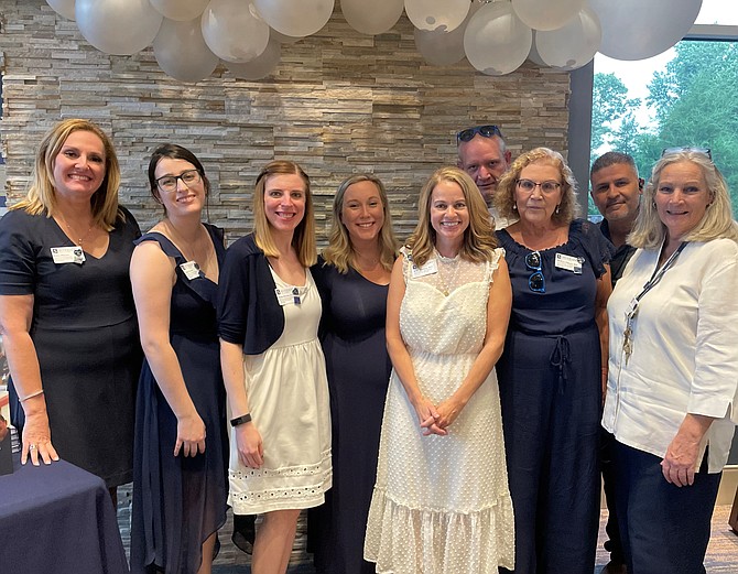 Silverado Senior Regional Administrator Katie Hilburn, fifth from right, stands with support staff at the 25th anniversary celebration of the organization’s founding June 16 at the Alexandria facility, which opened in 2018. Photo by Janet Barnett/Gazette Packet.