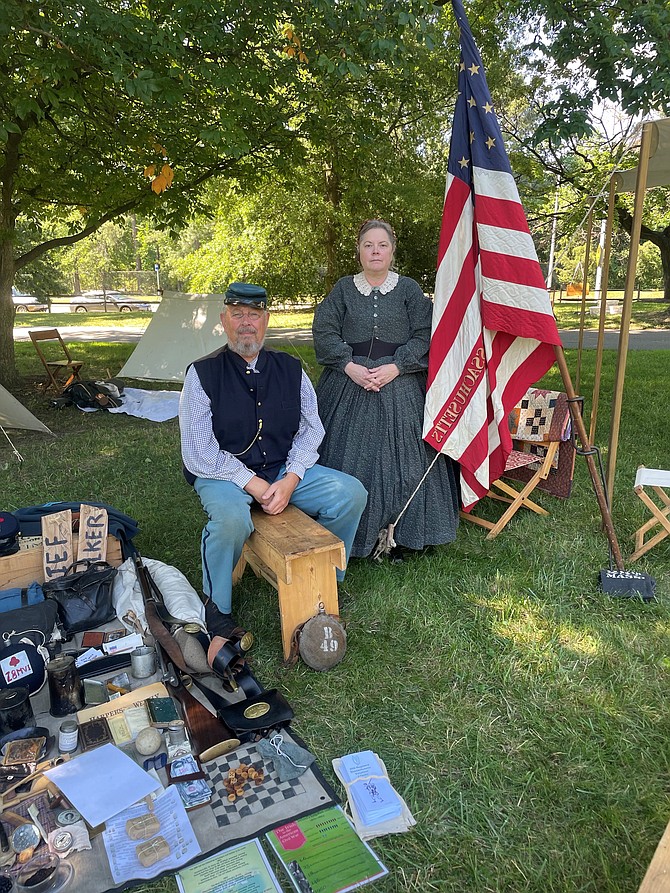 Reenactors Jerry Lynes and Rae-Ann Voelkners showcase items used during the Civil War at Camp Day June 18 at Fort Ward Museum and Park. Photo by Janet Barnett/Gazette Packet.