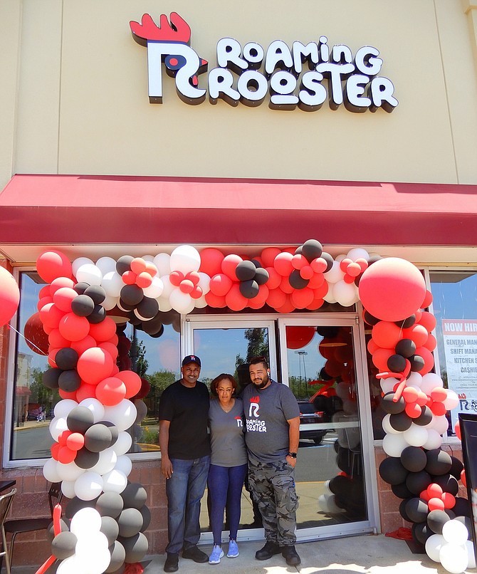 From left are Dismas Nyakudi, Conie Mesfin and store General Manager Ash Ziara outside the new Roaming Rooster in Chantilly.
