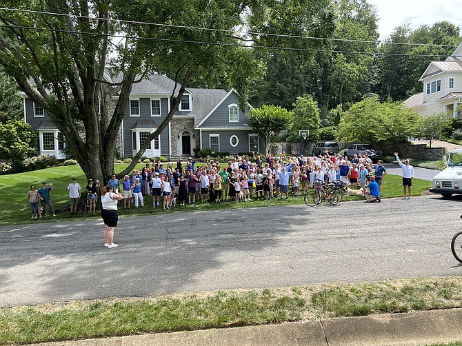 Retiring United States postal carrier Scott Arnold and some of the nearly 200 people and their dogs who live on his route.
