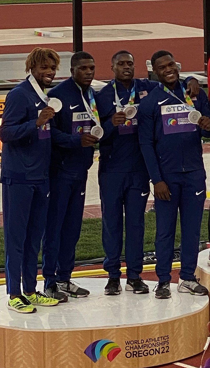 Alexandria native Noah Lyles, left, stands on the podium with the U.S. Men’s 4x100 relay team at the World Athletics Championships July 23 in Eugene, Ore. Earlier in the meet Lyles set a new world record in the men’s 200-meter race with a time of 19.31 seconds.