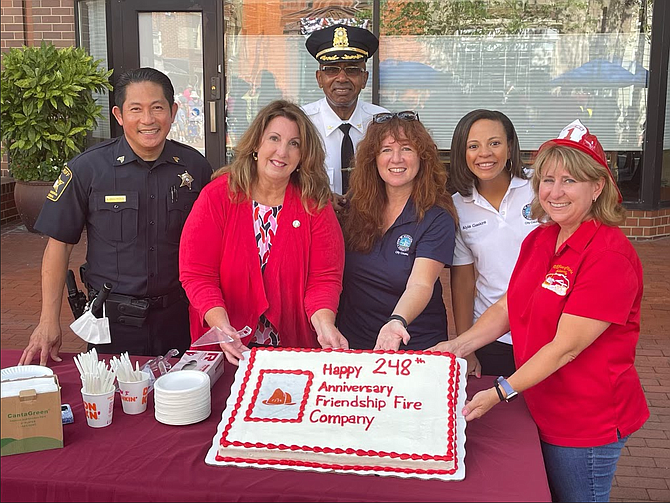 Office of Historic Alexandria director Gretchen Bulova, right, is joined by Sheriff’s Office Sergeant Waraphan “Sky” Srikongyas, vice Mayor Amy Jackson, Police Chief Don Hayes, and City Council members Sarah Bagley and Alyia Gaskins at the 248th anniversary of the founding of Friendship Firehouse at the Aug. 6 Friendship Firehouse Festival.