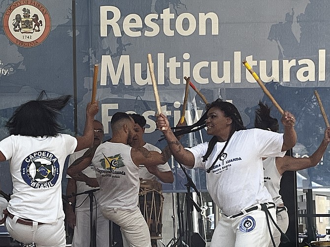Capoeira Luanda performs Brazil's fast and graceful Capoeira at the Multicultural Festival 2022. It is a blend of dance, martial arts, and acrobatics developed by enslaved West Africans in Brazil in the 16th century