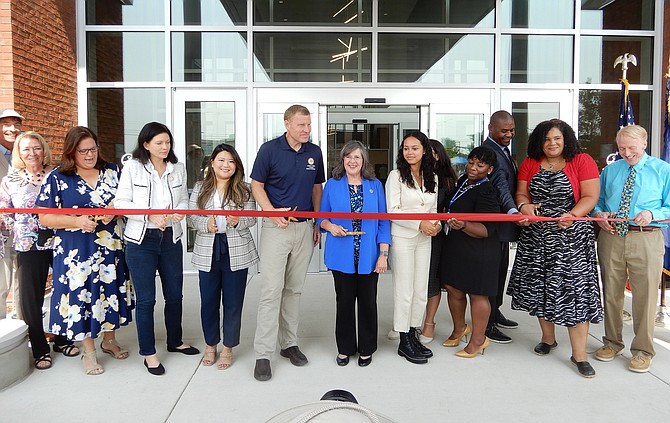 Among those cutting the ribbon are (fourth and fifth from left) Del. Karrie Delaney (D-67), Del. Irene Shin (D-86) and (at far right) Sen. George Barker (D-39).