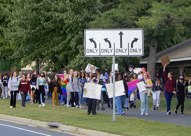 March participants displaying their signs and flags.