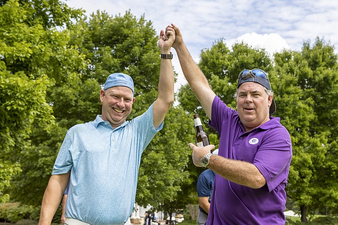 Sean Hartford is congratulated by Jim Fitzgerald after winning a playoff in golf tournament