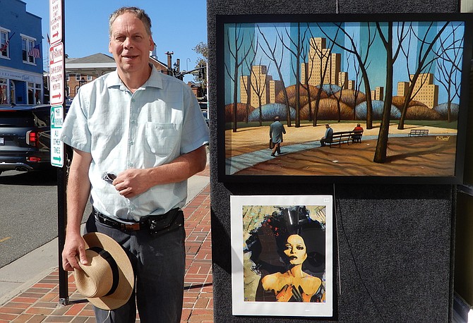 Richard McMurry displays his oil paintings.