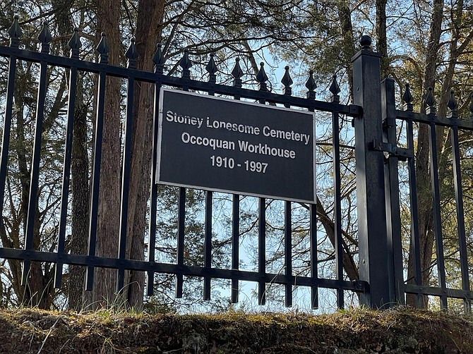 The quiet small plot believed to hold 50 to 100 unmarked graves is surrounded by a wrought iron fence and the Red Cedar trees emblematic of cemeteries and church graveyards