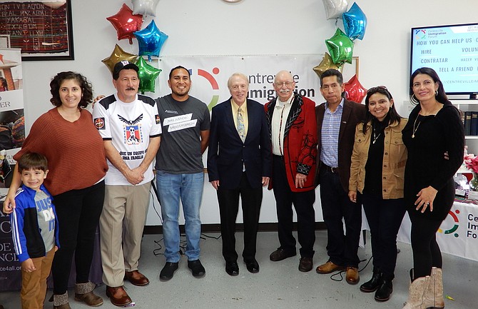 From left, CIF Development Manager Samantha Zaboli with her son, Samir Minda, 5; CLRC member Jaime Tejada; former CIF Community Organizer John Cano; Sen. George Barker; Jerry Foltz; Edgar Aranda; Claudia Álvarez and Vania Torres.