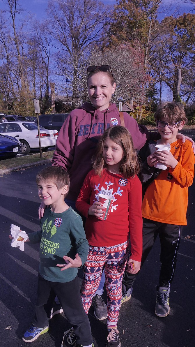 Kelly Bozzi has brought her three children — Dominic, Emilia and Leo to watch the voting process on Election Day in Arlington to show them what it is all about.
