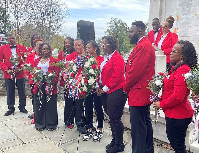 Members of the Magnus Joint Military Affairs Committee place at wreath honoring soldiers of the United States Colored Troops Nov. 6 at Alexandria National Cemetery. Photo by Janet Barnett/Gazette Packet