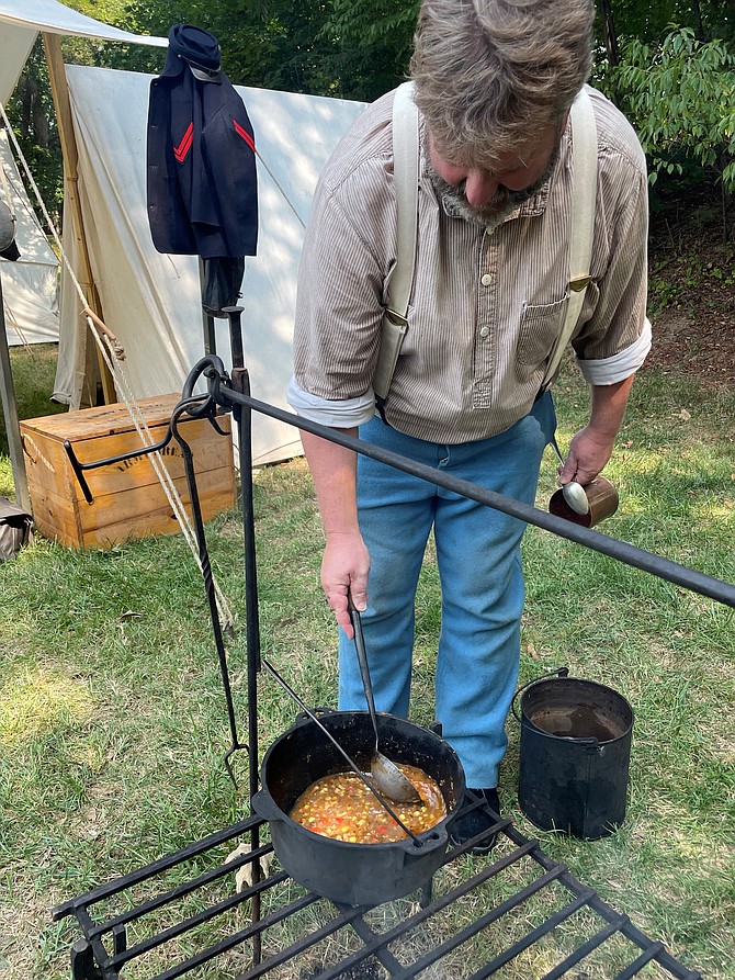 Bruce Michael Kressin prepares a traditional stew as part of Artillery Day Sept. 17 at Fort Ward Museum.