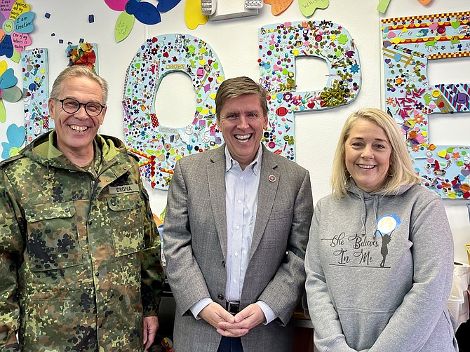 From left, Colonel Jörg Dronia, commander of the German Armed Forces Command in Reston, Supervisor Walter Alcorn (D), and She Believes in Me founder Renee Gorman.