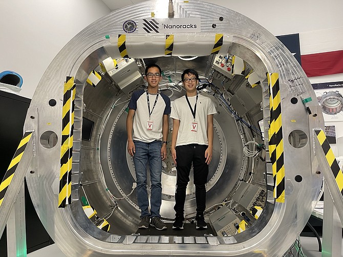 lan Hsu and Khoi Dinh at Nanoracks near the Johnson Space Center in Houston to deliver TJ REVERB