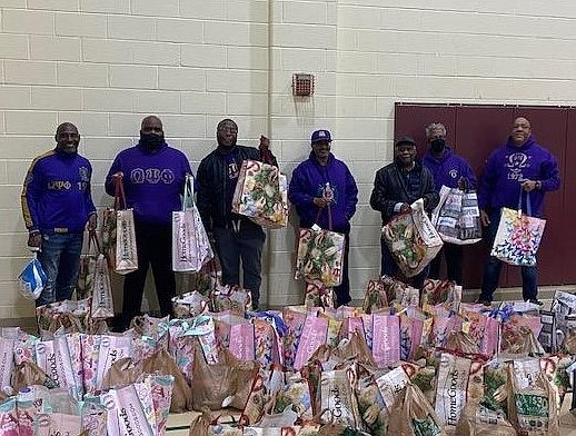 Volunteers from the Alexandria chapter of Omega Psi Phi prepare to give out Thanksgiving dinner baskets to families in need as part of the annual Friendsgiving dinner event Nov. 22 at Charles Houston Recreation Center.