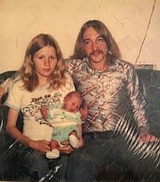 Police released this photo of 16-year-old Sharon Lane holding her baby daughter beside her husband Danny in 1976. She later had a son, as well.