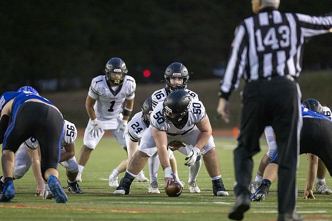 Mac Lewis #16 prepares to take the snap in Madison's 31-21 win in the VHSL Class 6 State semifinal